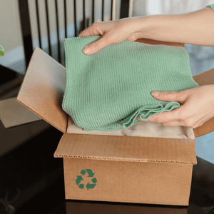 Blanket being packed away into a recycled box