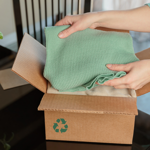 Blanket being packed away into a recycled box