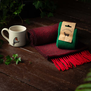 Ecofriendly gift including a herringbone scarf and robin mug and cashmere socks all sustainably made in Ireland by local makers and crafters