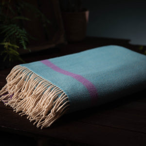 A contemporary take on the classic herringbone weave, in a Cashmere and Merino yarn weave with rolled fringe.