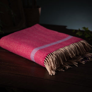 A contemporary take on the classic herringbone weave, in a Cashmere and Merino yarn weave with rolled fringe.