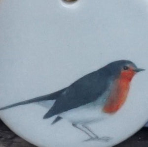 Close up image of one of the robin decorations in the two pack collection