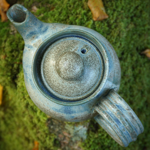 sky view of tea pot sitting on rock part of tea pot and herbal tea Irish Gift set
